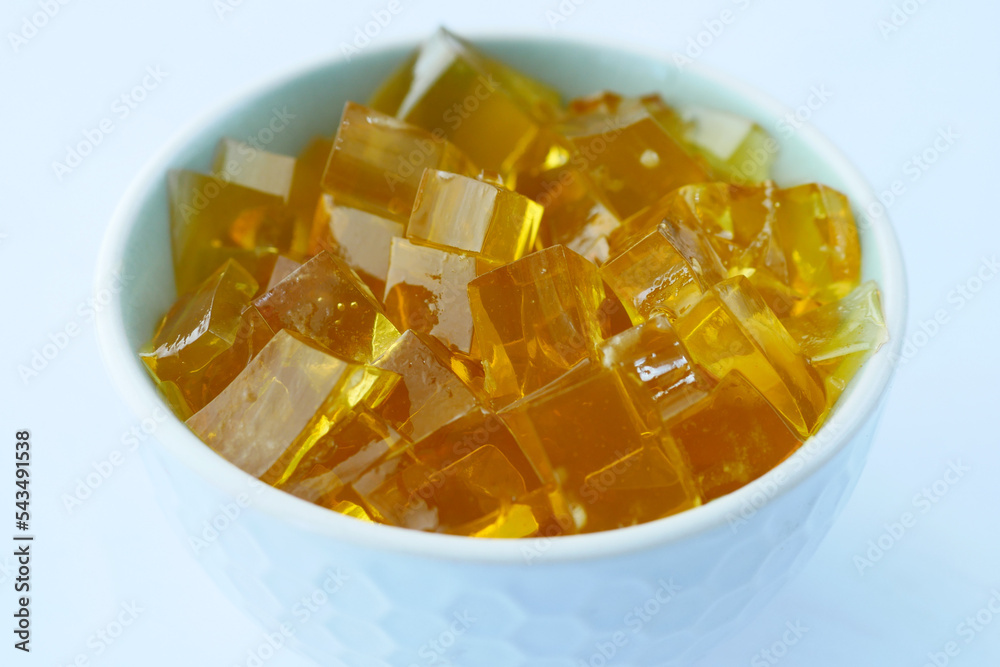 close up of colorful jelly on plate on table, close up of colorful jelly on plate on table,