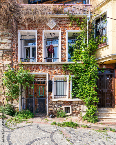 Beautiful old traditional red bricks houses in old Balat district, on a summer day, Istanbul, Turkey