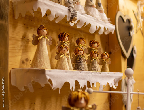 market stall showing an assortment of handmade Angle figures at traditional famous christmas market (Christkindlmarkt) at Merano, South Tyrol, Italy
