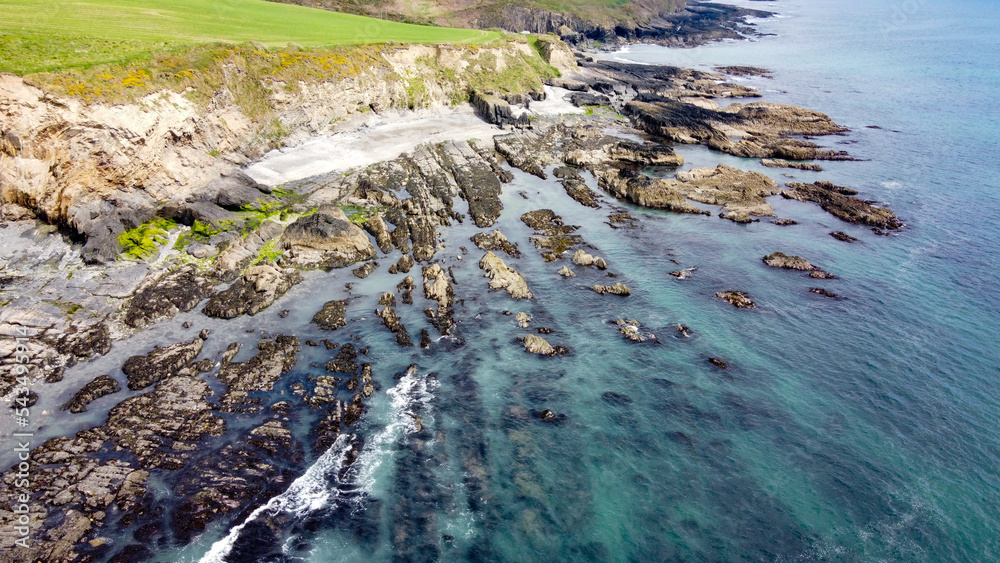 Aerial photo. View from above. The coast of the island of Ireland. A rocky reef in the Celtic Sea. Beautiful coastline of northern Europe. Nature of Southern Ireland.