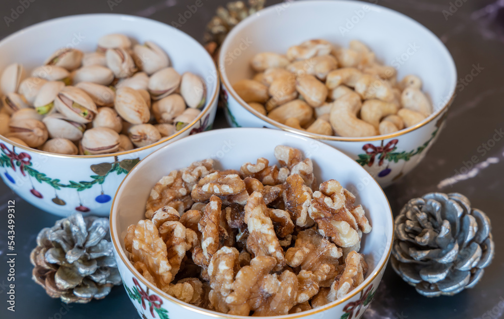 Three bowls of Christmas godies on the table. Three bowls of Christmas godies on the table.