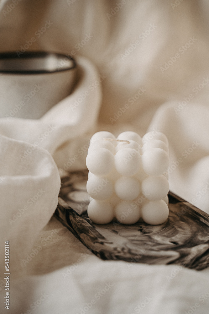 Obraz premium A candle burned on the table