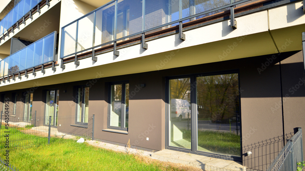 New apartment building on a sunny day. Modern residential architecture. The apartment is waiting for new residents. New apartment building on a sunny day. Modern residential architecture. The apartment is waiting for new residents.