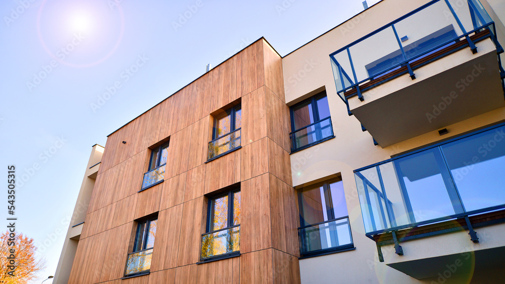 New apartment building on a sunny day. Modern residential architecture. The apartment is waiting for new residents. New apartment building on a sunny day. Modern residential architecture. The apartment is waiting for new residents.