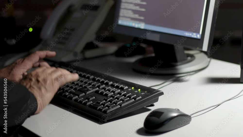 A self-confident specialist works on a personal computer, he controls the energy facility. Large monitoring room with professional people working in the dark.
A self-confident specialist works on a personal computer, he controls the energy facility. Large monitoring room with professional people working in the dark.