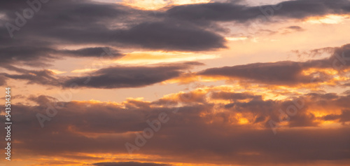 Beautiful dramatic sunset sky with clouds. Sunset sky background. © Inga Av