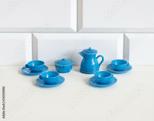 Miniature plastic coffee or tea set for a dollhouse photo