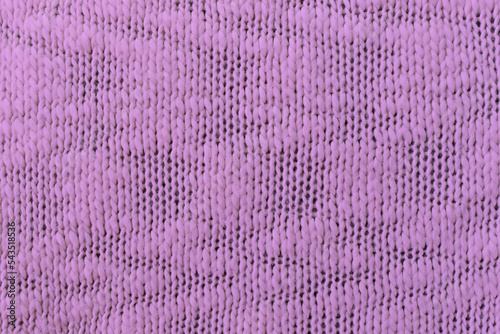 Knitted lilac pattern closeup, detailed yarn background.