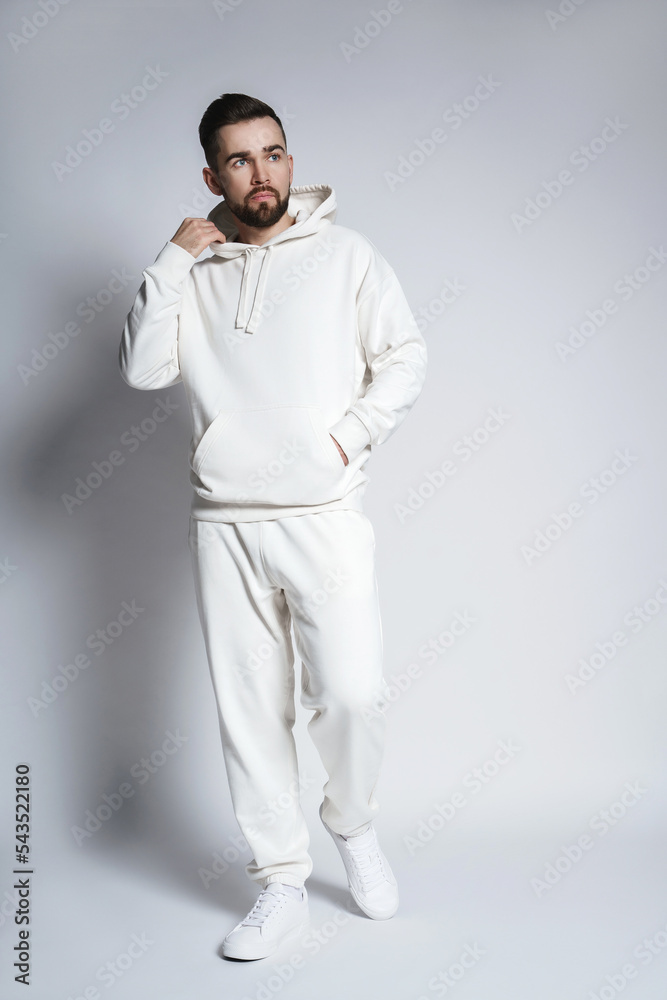 Handsome man wearing blank white hoodie and pants Handsome man wearing blank white hoodie and pants