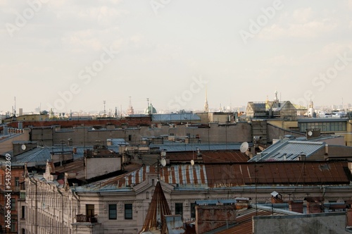 Roofs under a clear sky photo