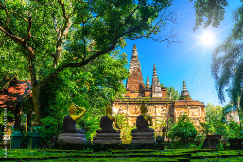 Wat Chet Yot or Wat Photharam Maha Wihan, seven pagoda temple It is a major tourist attraction in Chiang Mai, Thailand.with evening,Temple in Chiang Mai. photo