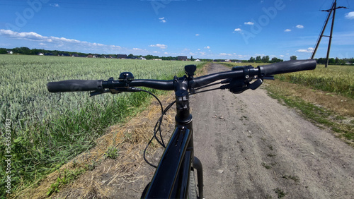 Gravel bicycle ride on the road in the summer season