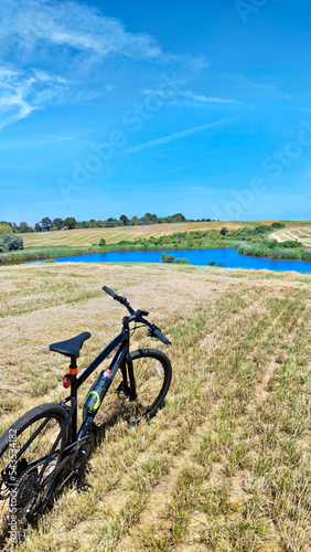 Fototapeta Naklejka Na Ścianę i Meble -  Gravel bicycle ride on the road in the summer season