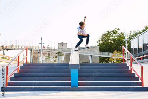 skater performing extreme tricks in park