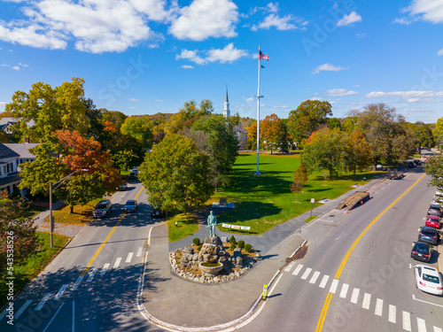 Lexington Minuteman Statue aerial view in fall on Lexington Common with First Parish Church, town of Lexington, Massachusetts MA, USA.  photo