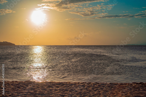 sunset on the beach, dusk with sea and sand