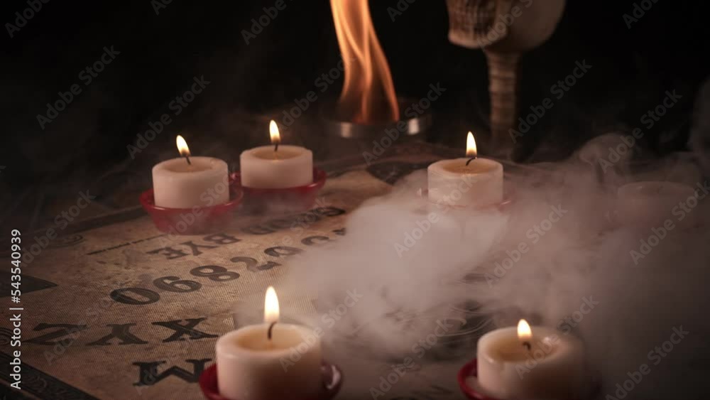 The Spiritual Witchcraft Ouija Board in Candle Light The Spiritual Witchcraft Ouija Board in Candle Light
