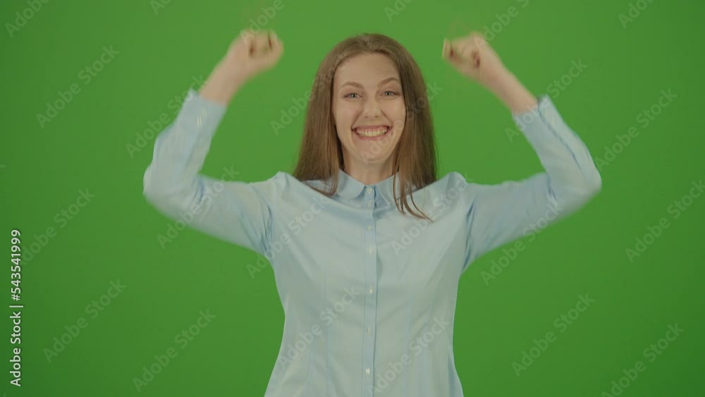 Green Screen. Chroma Key. Cute Pretty Woman Smiling Feeling Happy, Showing Positive Face Emotions. Woman Wearing in Blue Shirt while Celebrating Green Screen. Chroma Key. Cute Pretty Woman Smiling Feeling Happy, Showing Positive Face Emotions. Woman Wearing in Blue Shirt while Celebrating