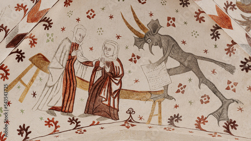 Medieval fresco with two women gossiping and a devil takes notes photo