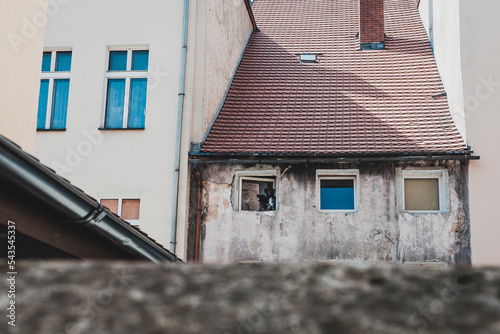 old building with winows and rooftop photo