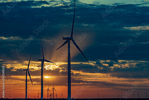 Windmills at sunrise in Dodge City, Kansas