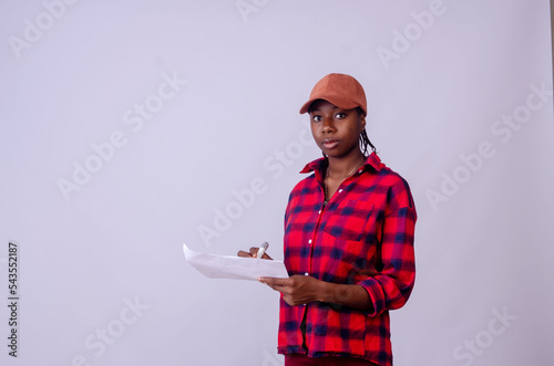 A businesswoman writing a discription on a paper photo