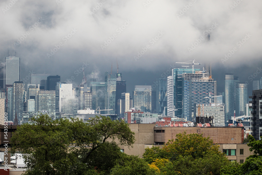 Toronto covered in clouds and fog in a storm