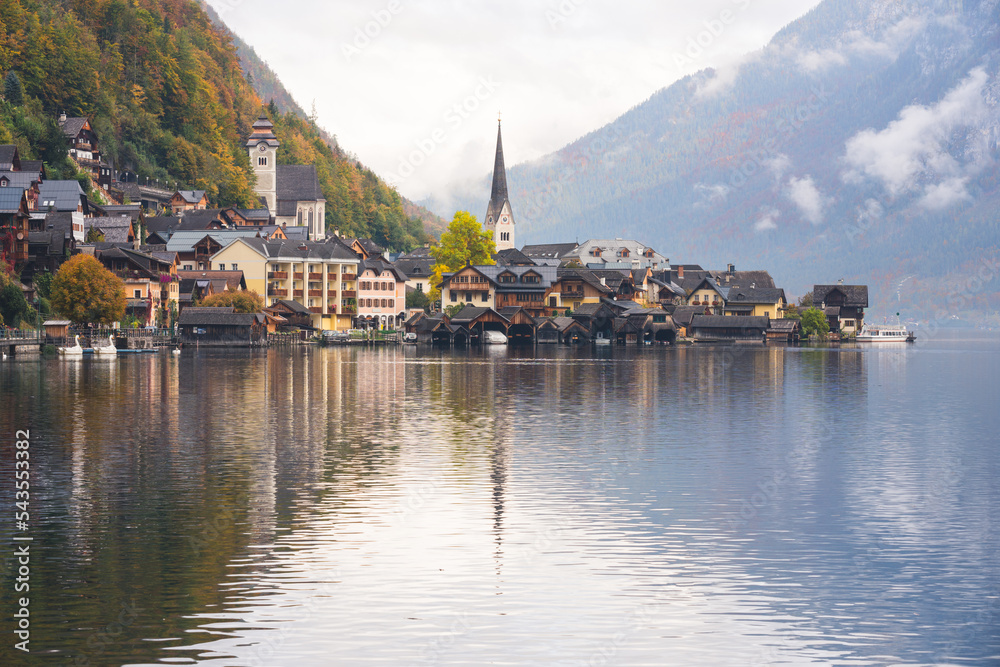 Beautiful Lakeside Village of Hallstatt in Austria with Charming Buildings and Mountains during a Cloudy Morning