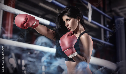 Sporty female boxer training in gym © Pixel-Shot