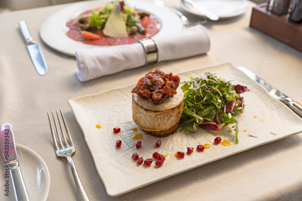 Grilled halloumi cheese with arugula and caramelized pear