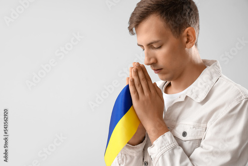 Young man with flag of Ukra...