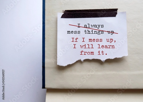 Stick note on a book with negative self talk written I ALWAYS MESS THINGS UP, replace with positive self talk IF I MESS UP I WILL LEARN FROM IT