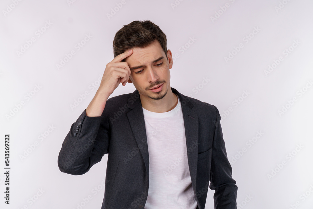 Portrait of thinking man surrounded by question mark on isolated background Portrait of thinking man surrounded by question mark on isolated background