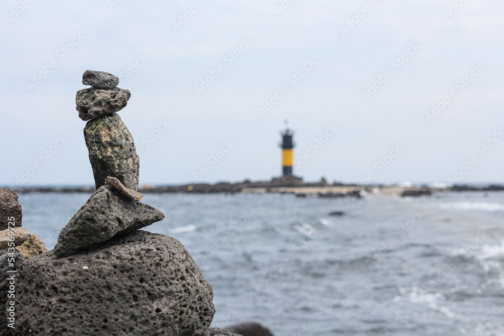 Small stone tower on the beach. Stock Photo | Adobe Stock