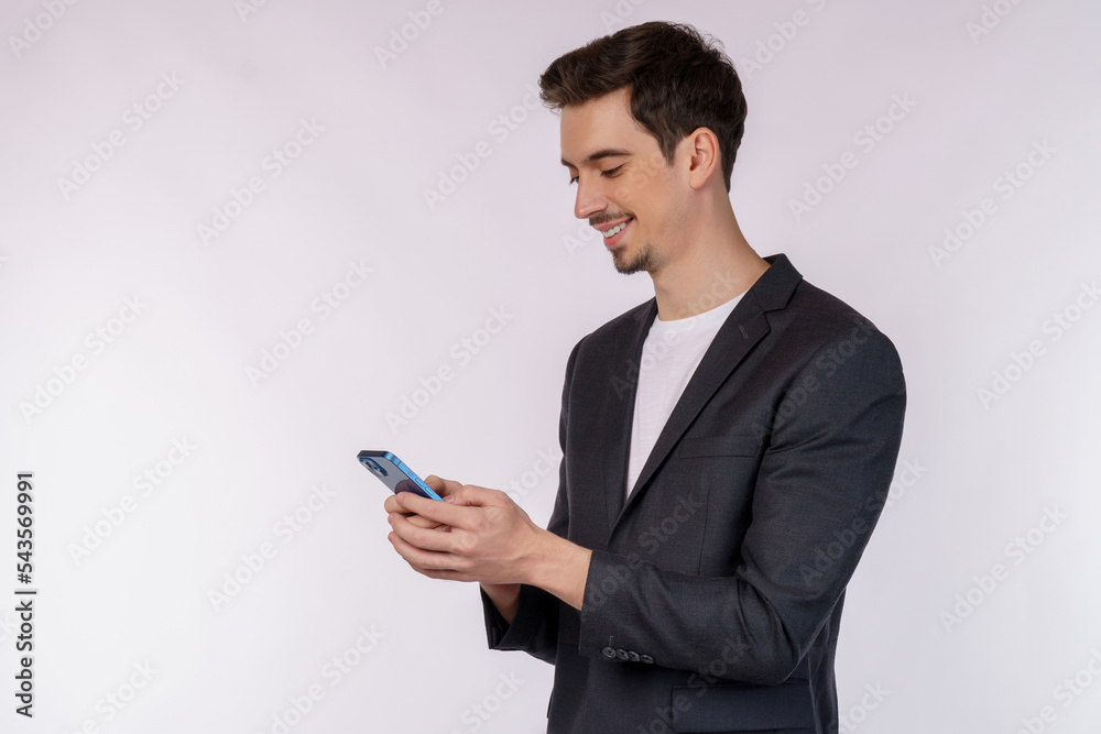 Portrait of a happy businessman using smartphone over white background Portrait of a happy businessman using smartphone over white background