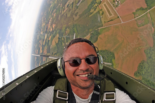 A Private Pilot Performs Acrobatic Manuevers In A Vintage P-51 Aircraft photo