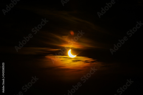 An amazing scientific background is a total solar eclipse in the dark red luminous sky, a mysterious natural phenomenon when the Moon passes between planet Earth and the Sun © netisovr