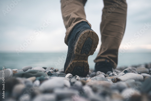 mens footsteps on the beach of sea