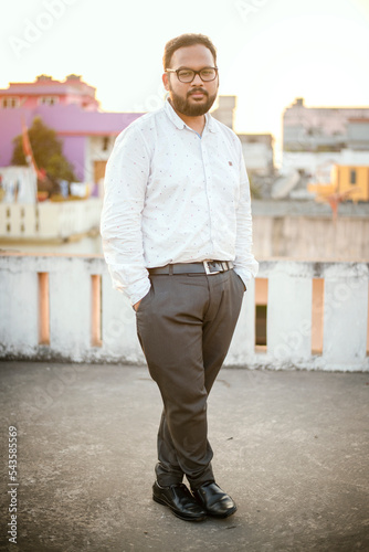 Middle age beard Indian Man posing for the camera