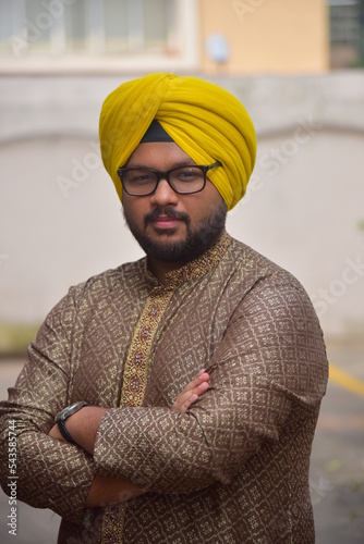 Middle age beard Indian Man posing for the camera
