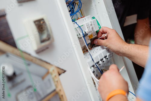 Electrician works cable checking energy