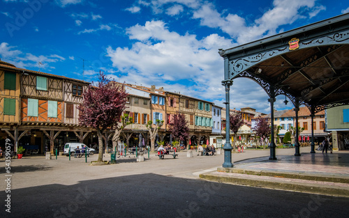 Fototapeta Naklejka Na Ścianę i Meble -  The covered market hall and the half timbered medieval houses on the main square of Mirepoix, in the South of France (Ariege)