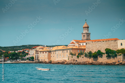 Panoramic view of the old town of Krk in Croatia, cathedral tower and seascape in background