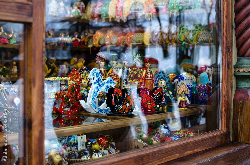 Russian tradition folk souvenirs on fair, in the souvenir shop in the window - Christmas wooden toys. Craft, handicrafts, 