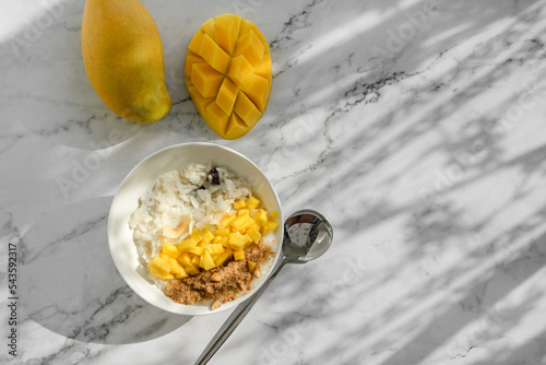 rice porridge with mango on coconut milk