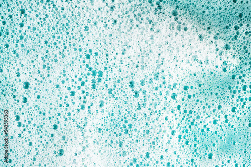 soap foam on blue foch texture background backdrop