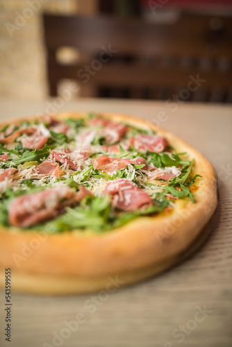 pizza with prosciutto and arugula