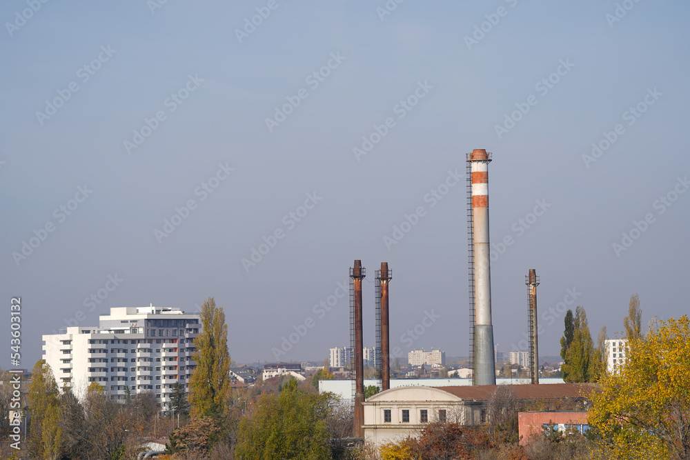 Obraz premium The chimney of a thermal power plant, the smoke extracted by a thermal power plant on the chimney, in the production process. Environment. Pollution.