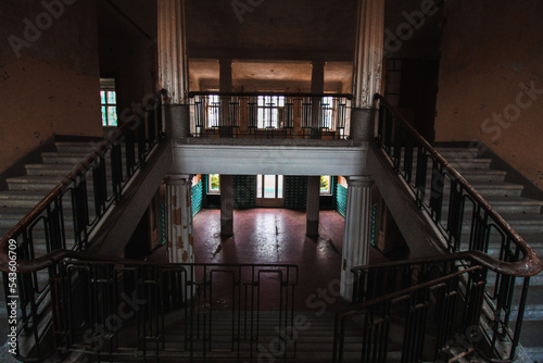 old staircase in a lost place, abandoned Hall with columns and stairs