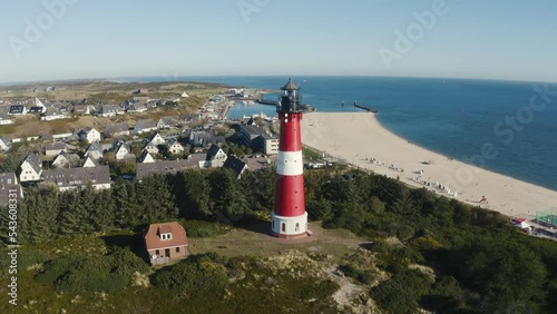 Lighthouse Hörnum, Sylt, Germany. Schleswig-Holstein, North Sea. 4K drone. Beautiful tourist destination and attraction from above.